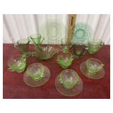 Green glass cup and saucers, plates, cream and