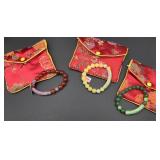 3 Bracelets With Silk Bags