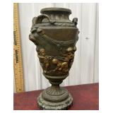Bronze rams head urn marble base
