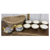 Hand painted, signed Italian pottery in a basket