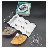 Pierced earrings, bracelets, intricate purple