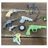 Toy guns, spurs, keys etc