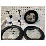 wrought iron candle holders, and round mirrors