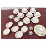 Tea cup and saucers, cream and sugar dishes, salt