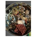 Tin full of misc watches, earrings, necklaces,