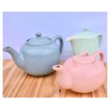 3 Art Deco Pastel Teapots. Nic on blue one.