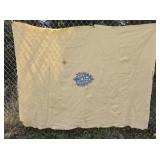 Early homespun wool blanket with blue emblem in