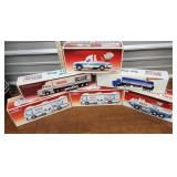 6 Wilco toy trucks and bank