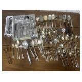 Assorted flatware, serving utensils
