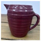 Stoneware burgundy pitcher