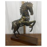 Metal horse figure on wood base