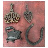 Cast iron trivets, horse shoe wall hanging