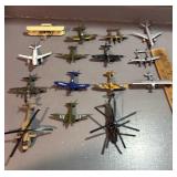 Vintage metal airplanes, and helicopters.