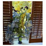Gorgeous blue vase with flowers
