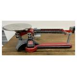 Has Scale Corp. triple beam balance.