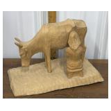 Signed hand carved wooden cow / milking