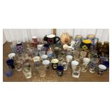 Assorted shot glasses, mugs