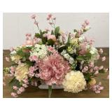 Faux flower arrangement in pottery pot