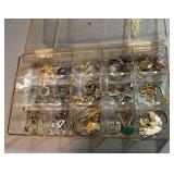 Case of rings, necklaces, earrings, and more.