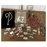 Necklaces, bracelet, watch, earrings, jar of