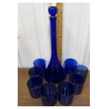Blue glass decanter, glasses