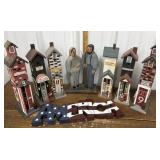 Painted wood farmer family, town buildings,