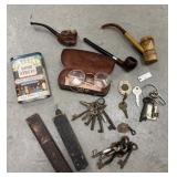 Pipes, sketches, tobacco tin, glasses, straight