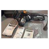 Worx 14ï¿½ electric chainsaw with paperwork.