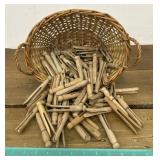 Vintage clothespins in little wicker Basket.