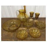 Amber glass pitcher, candle holders, bowls