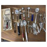 Assorted kitchen utensils- slotted spoons,