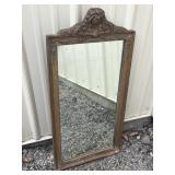 Ornate frame, heavy mirror
