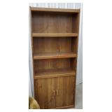 Bookshelf with storage in base
