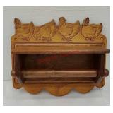 Paper towel holder with carved chickens