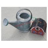 Watering can in barn birdhouse