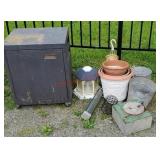 Tin cabinet and pile of planters, tin buckets,
