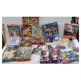 Large box of puzzles, beads, and CDs