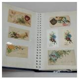 Album of vintage calling cards and calendars