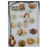 Tray of jewelry mostly brooches