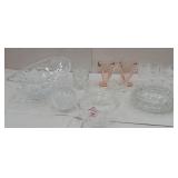 Box of mostly clear glass with pink creamer and