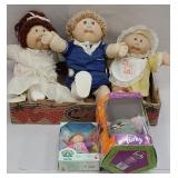 Box of cabbage patch dolls and furby