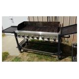 Members mark large propane grill with cover