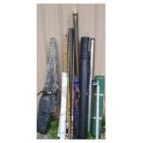 Pile of fishing tubes with fishing pole parts and