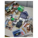 Piled high box of fishing and hunting related