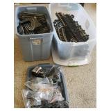2 large plastic tubs of track, train power pack,