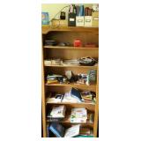 Contents of middle shelf includes office stuff,