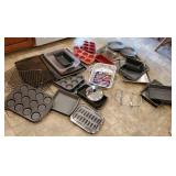 Huge pile of bakeware - cookie sheets, cake pans,