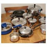 Table full of stainless steel pans