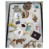 Tray of miscellaneous jewelry, pins, pendants,