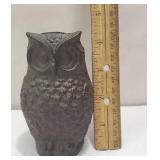 Small cast iron owl that is hinged and opens on